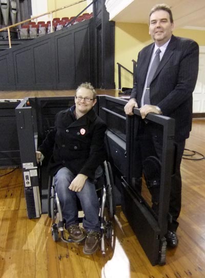 Kendall Akhurst, about to enter the wheelchair stage lift, and Craig Woolliams