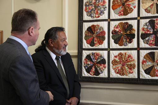 Richard Benge and the Hon Dr Pita Sharples admire the Dresden Plate Quilt in Parliament House