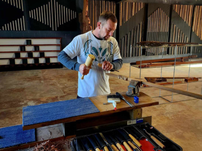 Mark Lang carving in his Northland workshop