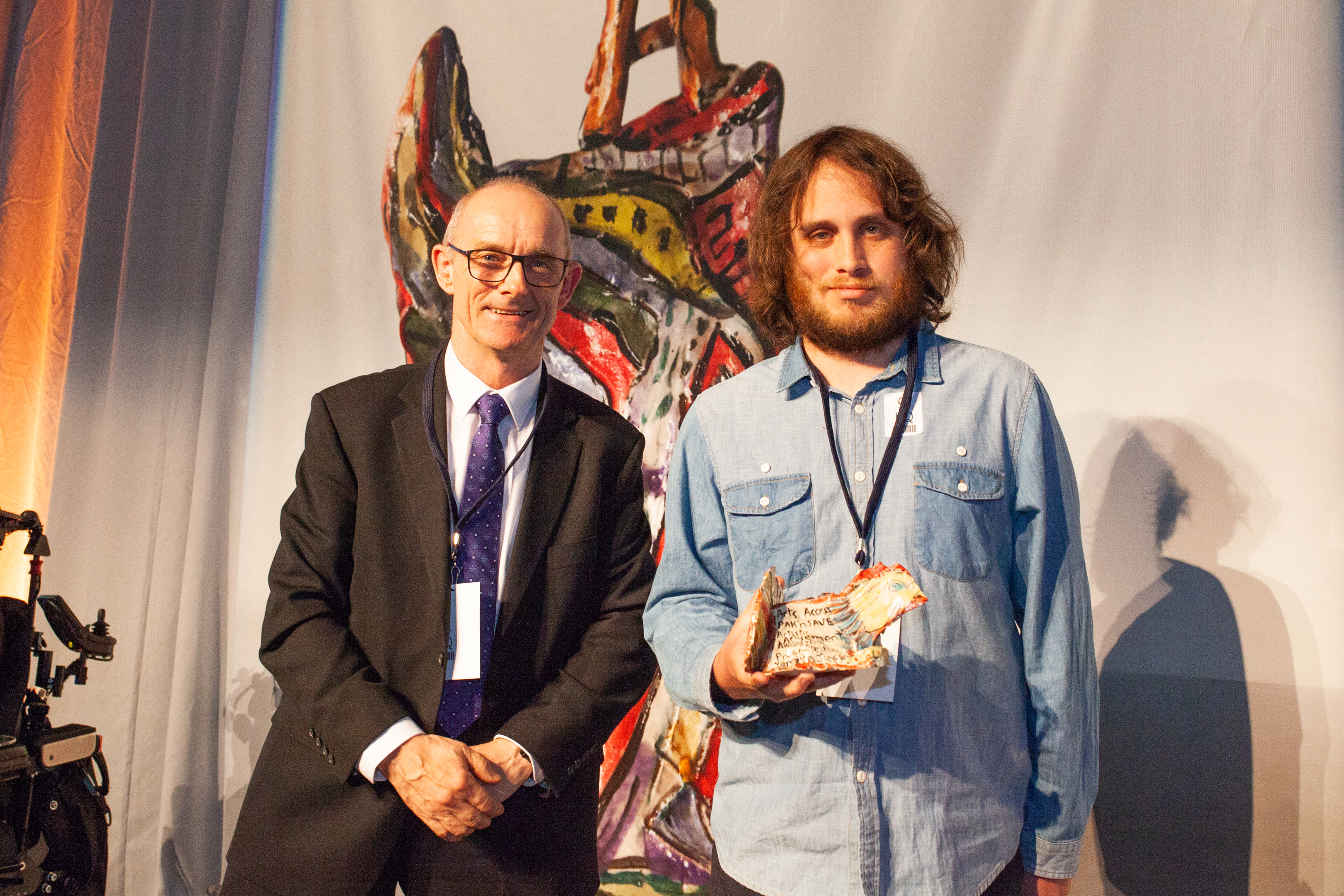 Artist Yaniv Janson with one of his artworks.