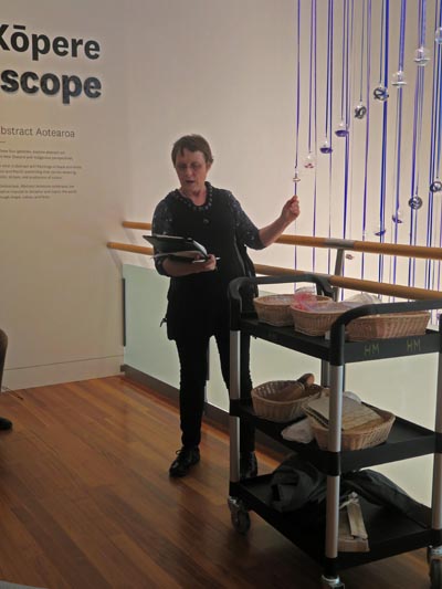 Judith Jones leads a sensory tour at Te Papa, using her hands to demonstrate as she speaks