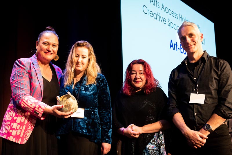 Hon Carmel Sepuloni presents the Arts Access Holdsworth Creative Space Award to Lis Rate-Smith, Deborah Kavanagh and Geoff Howard of Art-East.
