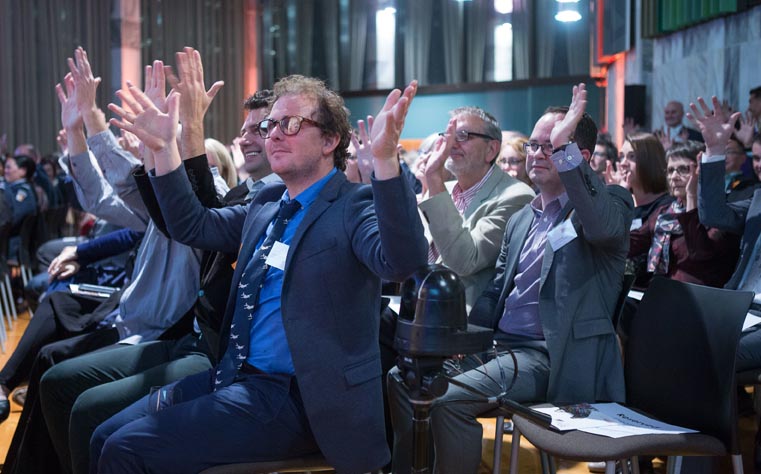 Audience members applaud in NZSL during the 2016 Arts Access Awards ceremony.