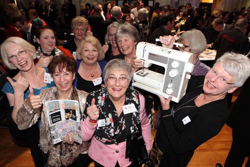 Quilt-Stitch Group pose with their prizes