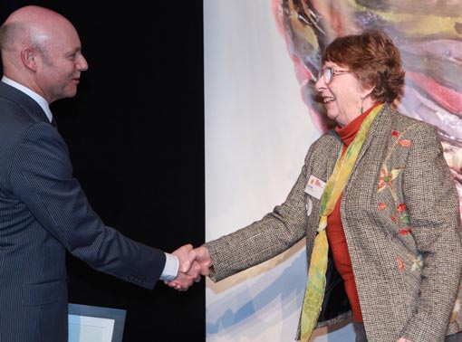 Ray Smith, Department of Corrections, with June Nixey of the volunteer Shut-in Stitchers