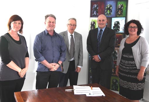 Jacqui Moyes, Richard Benge and Howard Fancy (Arts Access Aotearoa), with Stephen Cunningham and Barbara Jennings (Department of Corrections) sign the contract