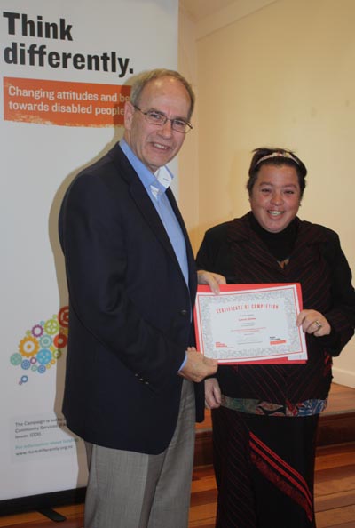 Mayor Len Brown presents a certificate to participant Loren Glenn