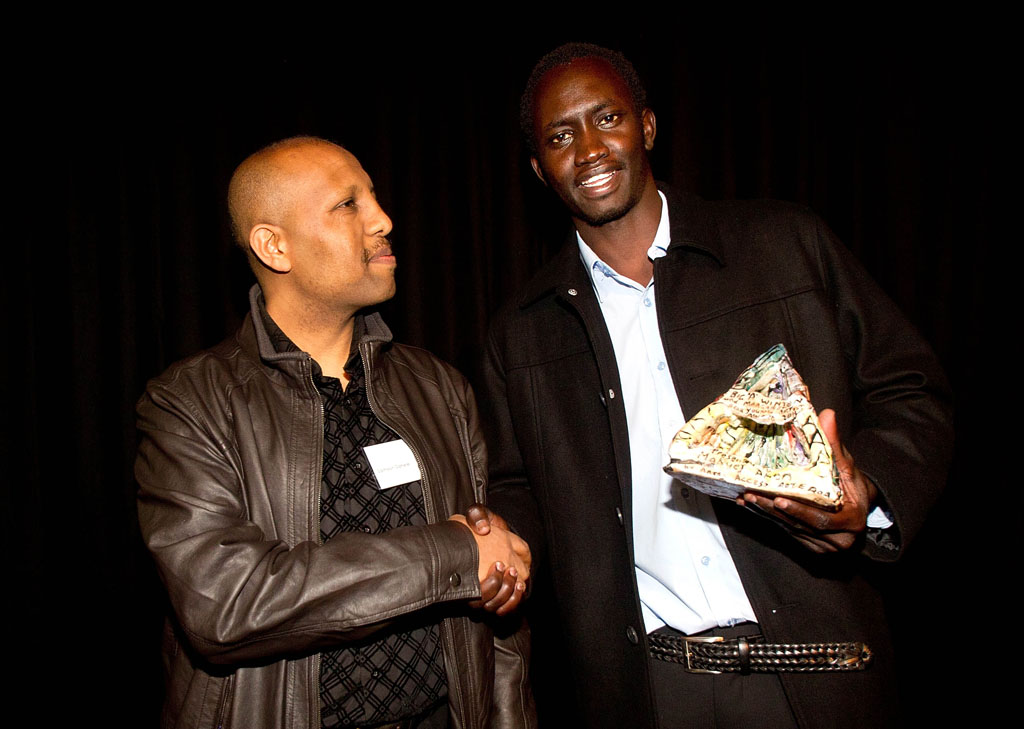 Samson  Sahele congratulates Makuei Aken, recipient of the Big 'A' Winton and Margaret Bear Young Artist Award 2011