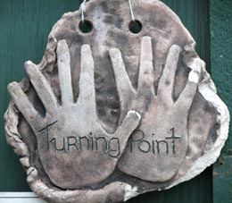 Artwork hangs on the door of Turning Point Trust