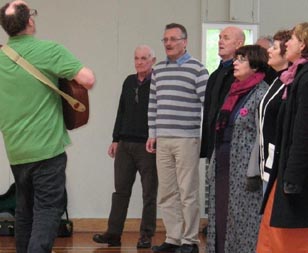 Julian Raphael and members of the Wellington Community Choir