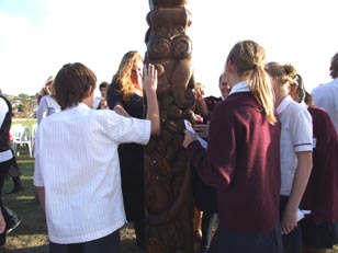 Albany Junior High School students gather around the poupou